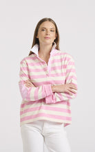 Load image into Gallery viewer, Sporty year-round style. This model looks great in our green and white striped rugby jumper, proving it's a versatile piece for any season. The breathable cotton and relaxed fit make it perfect for layering, while the contrasting elbow patches, collar stand and front placket add a point of difference.