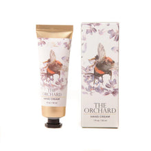 Load image into Gallery viewer, 30ml tube of hand cream with a print of Meg Hawkins water colour art  in a bee design. Gold tube with black lid and presented in a full colour box.