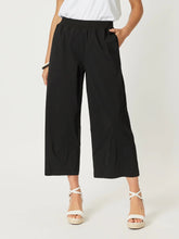 Load image into Gallery viewer, Black ribbed waist stretch pant in bengaline fabric. A pull on pant that a super comfy in a cropped length and featuring side pockets.