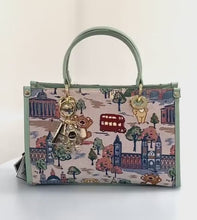 Load and play video in Gallery viewer, Henney Bear Top Handle Bag with Charms - London Bridge