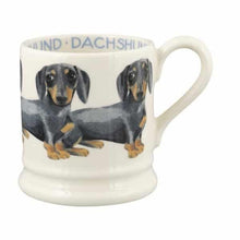 Load image into Gallery viewer, A 1/2 pint mug, so a decent size. Handmade pottery from the UK and holds 300mls. Decorated with black & tan dachshunds.