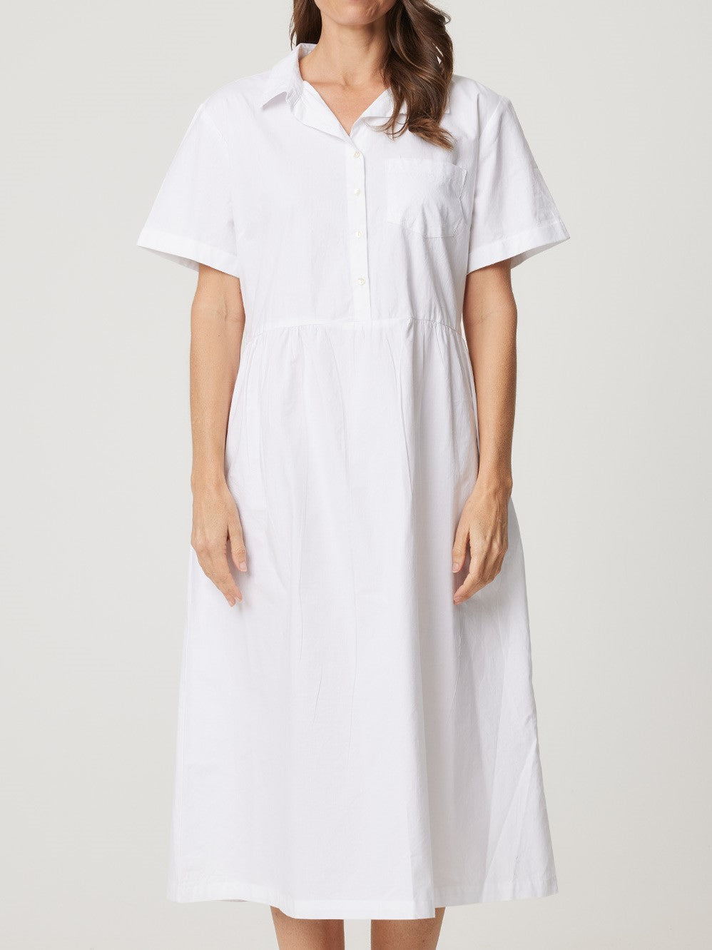 Midi dress in white with short sleeves, slightly tapered waist, A line skirt and button bodice.