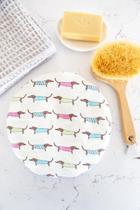 A fun shower cap crafted from linen printed with sweet little dachshunds on the outer and a water resistant lining. Fun for all those dog lovers.