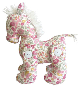 A stuffed toy horse in pretty pink florals and a soft mane with buttoned legs that can move