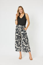 Load image into Gallery viewer, Hammock &amp; Vine relaxed fit wide leg pull on pant with side pockets in a green ivy print on white.
