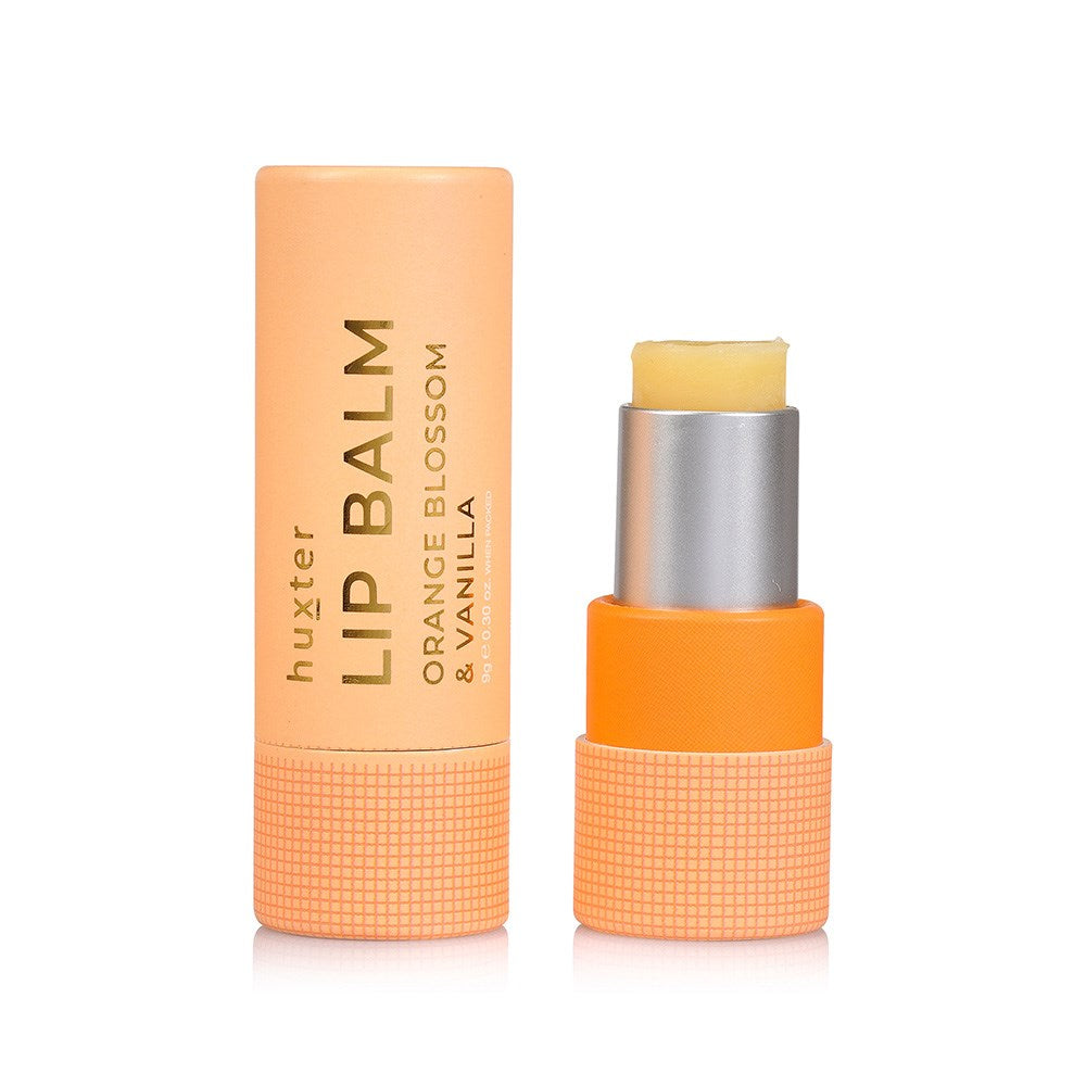 Huxter Orange blossom & vanilla lip balm in soft orange packaging