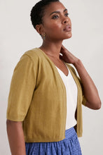 Load image into Gallery viewer, Lightweight organic cotton cardian with elbow length sleeves and a cropped fit. Open front. Colour is Pear.
