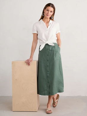 Linen skirt in linen with full button front, angle pockets on the front, back patch pockets and midi length.